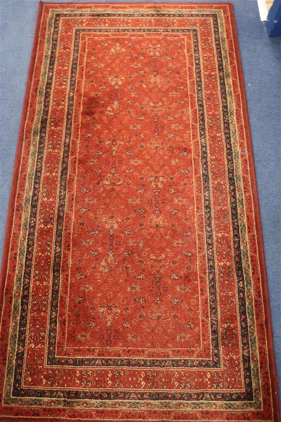A red ground rug, 160 x 83cm